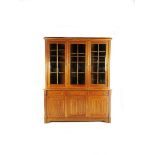 A large William Ingham oak glazed bookcase in the manner of A W N Pugin, probably for