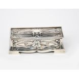 An Art Nouveau William Hutton & Sons Ltd silver casket, rectangular, on four shaped feet, with