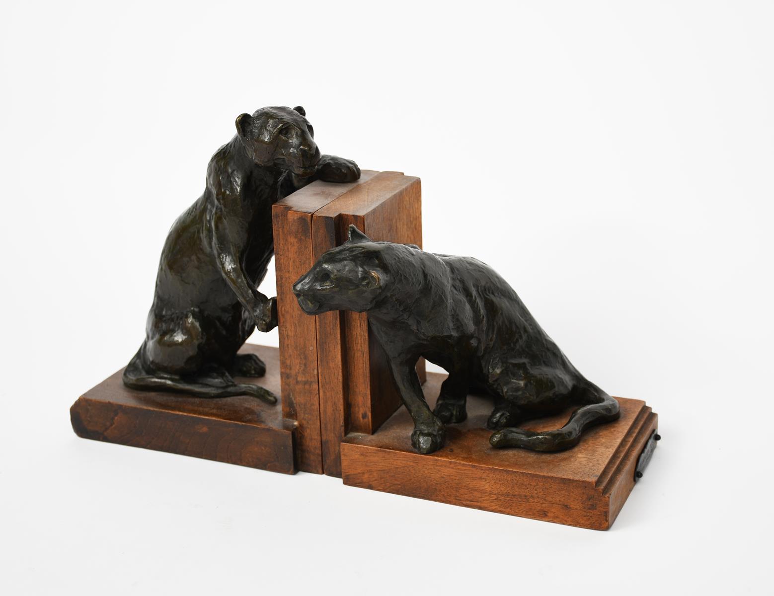 Roger Godchaux (1878-1958) Panthers a pair of patinated bronze book ends, wooden bases applied