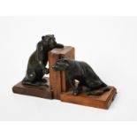 Roger Godchaux (1878-1958) Panthers a pair of patinated bronze book ends, wooden bases applied