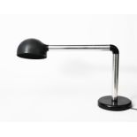 A Swiss Lamps International polished metal and plastic table lamp designed by Robert Haussmann,