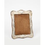 A W J Myatt & Co silver mounted oak easel back photograph frame, rectangular, cast in low relief
