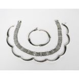 A Mexican silver necklace and bracelet, curved, streamlined link panels, another bracelet and a pair