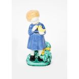 A Wiener Keramik model of a girl holding a bird the design attributed to Bertold Loffler or Ida