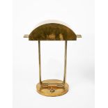 A modern nickel plated desk lamp originally designed by Marcel Breuer, circular, flat base