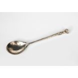 An Omar Ramsden silver spoon, cast Tudor rose terminal, hammered finish, stamped marks, London