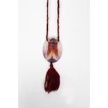 Cicada a Gabriel Argy-Rousseau pate de verre glass pendant, cast in relief, with silk tassel and