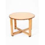 An Art Deco bird's eye maple occasional table, round on rectangular legs with low cross stretcher,