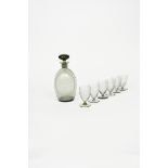 ‡ Sir Laurence Whistler CBE (1912-2000) an early rare glass decanter and stopper and six glasses,