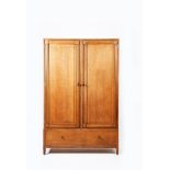 A Bath Cabinet Makers oak cupboard, two hinged door fitted cupboard, with full length mirror- inside