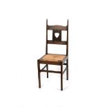 A rare oak side chair designed by Charles Francis Annesley Voysey, the oak frame, back with extended