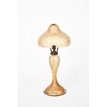 A Continental glass table lamp and shade, tapering form with mushroom shade, mottled orange and