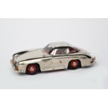 A Marklin tin-plate model of a Gul-wing Mercedes 330 SL, commemorating the 40th Anniversary of the