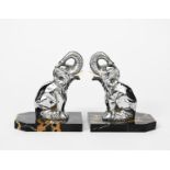 Hippolyte Moreau (1832-1927) Seated Elephants a pair of silvered metal book ends, with bone tusks,