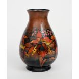 'Flambe Orchids' a large Moorcroft Pottery vase designed by William Moorcroft, pear shaped vase,