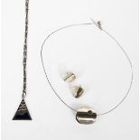 A Mexican silver necklace and earrings, circular with pierced aperture, and a small English silver