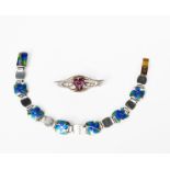 A silver and enamel bracelet in the manner of James Fenton, square panels, enamelled with blue and