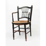 A Morris & Co Rossetti armchair the design attributed to Dante Gabriel Rossetti, ebonised ash with