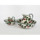 A Wemyss Ware Cherry wash basin and ewer, painted with sprays of fruiting cherry in green and