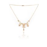 An Edwardian seed pearl-set gold necklace, of scrolling floral design set in closed back yellow gold