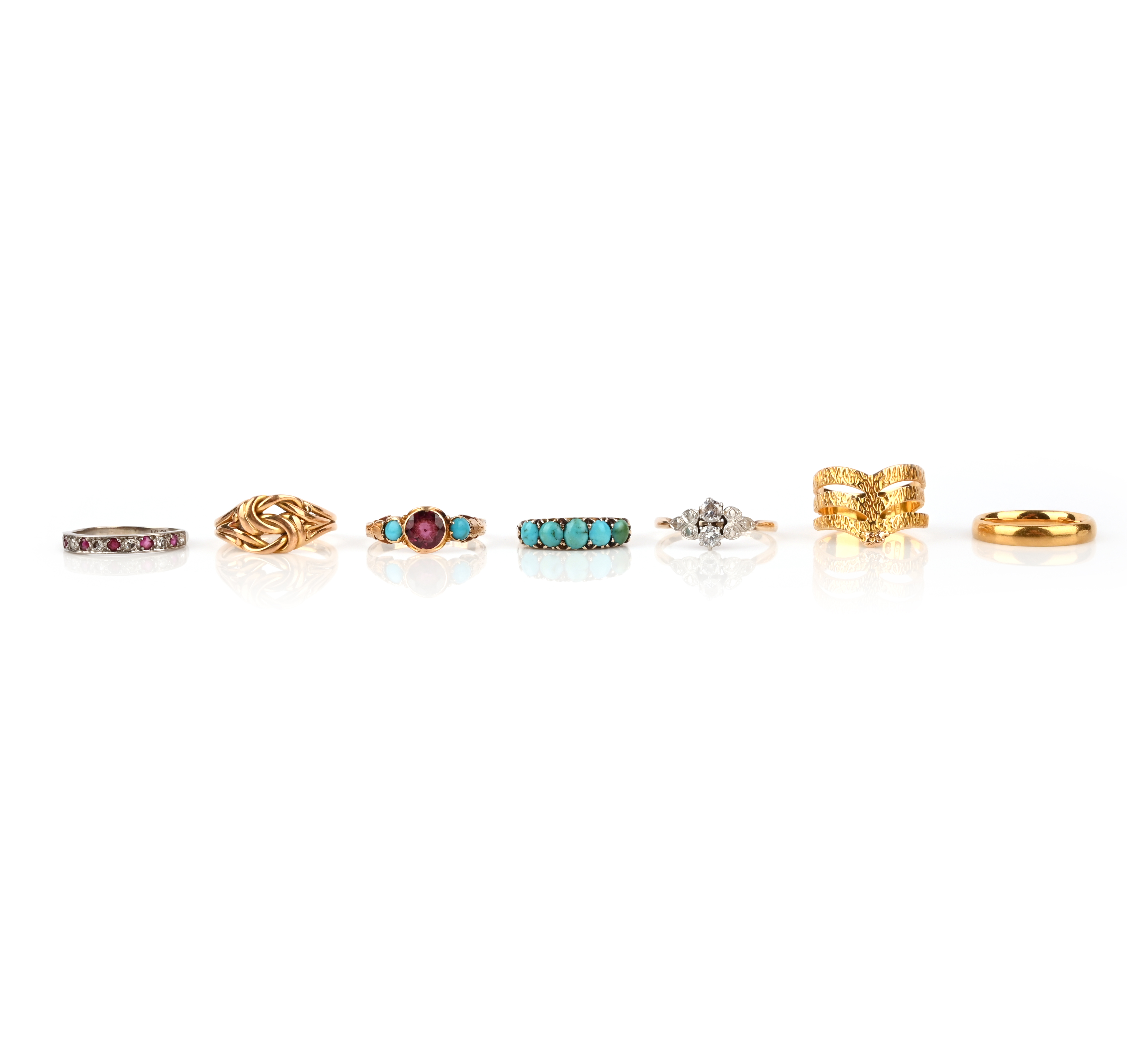 A group of 7 rings, including a diamond two-stone ring, set in platinum and gold, size P, a