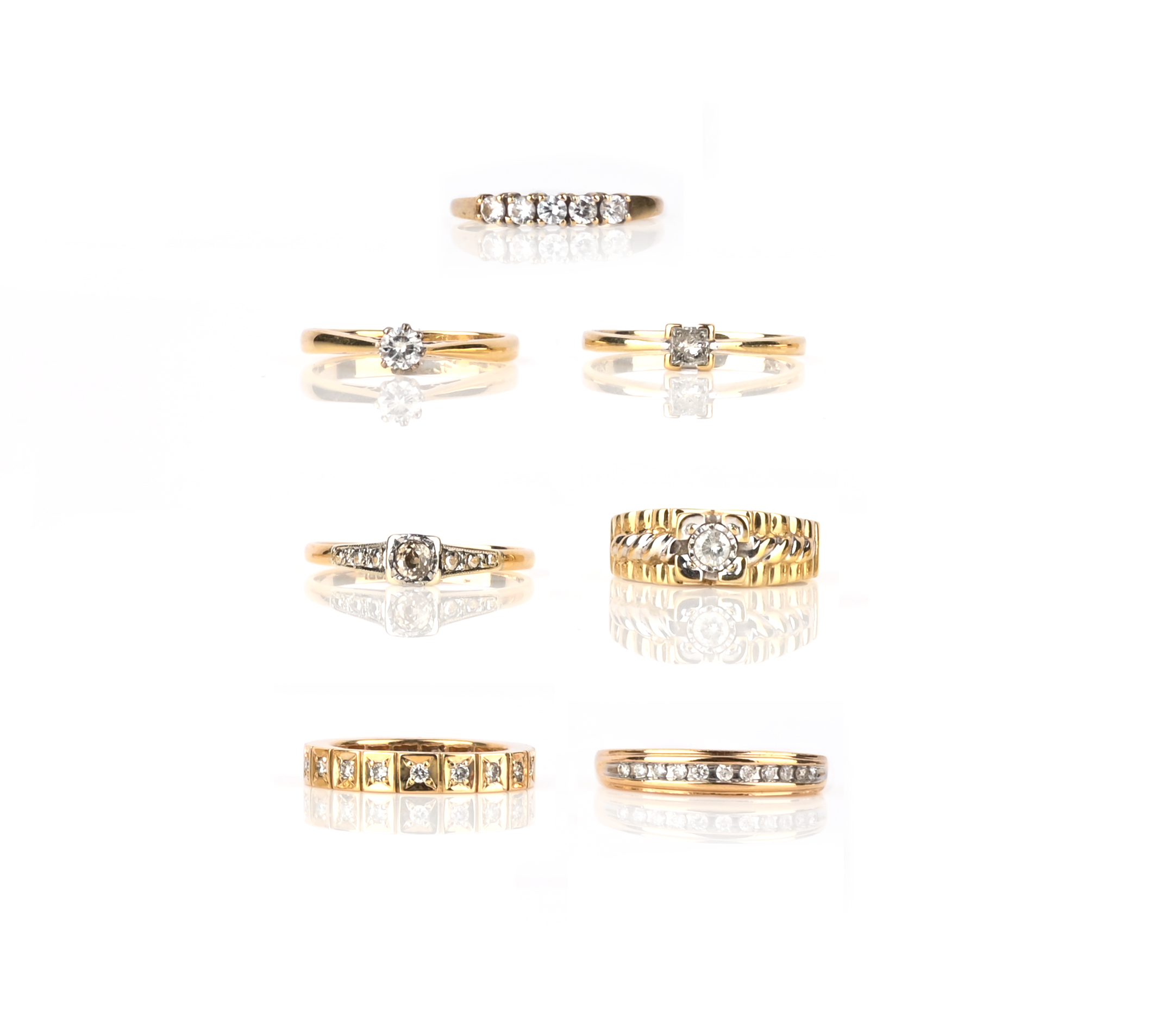 A group of six diamond rings, comprising: one diamond full eternity ring, size K, British