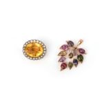 A citrine brooch and a multi-stone pendant, the brooch set with an oval citrine within a border of