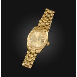 Rolex, a ladies gold Datejust wristwatch, signed champagne dial with diamond hour markers, date