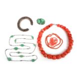 A large coral necklace, with a smaller coral bead necklace and an orange bead necklace, with a