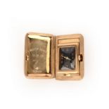 Asprey, a small 9ct gold travel clock, black rectangular dial with Arabic numerals and subsidiary