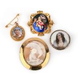 A group of four gold brooches, comprising: an oval brooch with a shell cameo of Zeus and Ganymede;