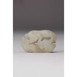 A CHINESE WHITE JADE 'DOUBLE BADGERS' PENDANT 18TH/19TH CENTURY Carved with two feline-like badgers,