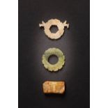 THREE CHINESE ARCHAIC JADE ORNAMENTS WESTERN ZHOU AND EASTERN ZHOU DYNASTY Comprising: a flat opaque