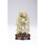 A CHINESE PALE CELADON JADE CARVING OF THE HEHE ERXIAN QING DYNASTY The twin spirits of Mirth and
