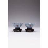 A FINE PAIR OF CHINESE DOUCAI 'LOTUS' BOWLS QING DYNASTY The exteriors painted with stylised lotus