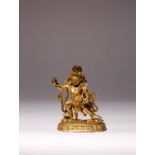 A RARE TIBETAN GILT-BRONZE FIGURE OF VAJRADHARA 17TH/18TH CENTURY Standing in a dynamic pose on a