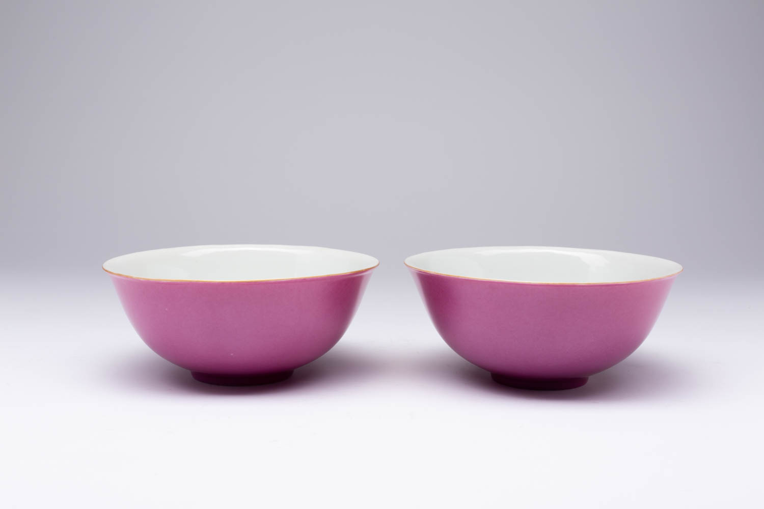 A PAIR OF CHINESE IMPERIAL PINK-ENAMELLED BOWLS SIX CHARACTER XUANTONG MARKS AND OF THE PERIOD