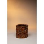 A CHINESE CARVED HARDWOOD BRUSHPOT, BITONG QING DYNASTY The cylindrical body carved to the