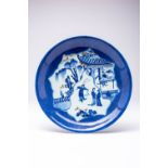 A RARE CHINESE UNDERGLAZE BLUE AND COPPER-RED 'FIGURAL' DISH SIX CHARACTER KANGXI MARK AND OF THE