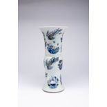 A CHINESE UNDERGLAZE BLUE AND COPPER-RED 'PHOENIX' BEAKER VASE, GU KANGXI 1662-1722 Decorated with