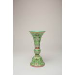 A CHINESE FAMILLE ROSE LIME-GREEN GROUND GU-SHAPED VASE SIX CHARACTER JIAQING MARK AND PROBABLY OF