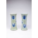 A LARGE PAIR OF CHINESE CELADON-GROUND BEAKER VASES, GU KANGXI 1662-1722 Each painted with six