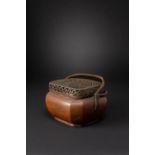 A CHINESE COPPER HANDWARMER AND COVER LATE QING DYNASTY The canted rectangular body with swing