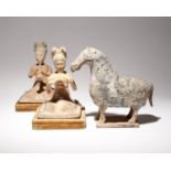 A PAIR OF CHINESE PAINTED POTTERY FIGURES OF MUSICIANS AND A POTTERY MODEL OF A HORSE PROBABLY