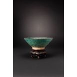 AN IRANIAN POTTERY SILHOUETTE-WARE BOWL C.12TH CENTURY Of conical form and raised on a straight