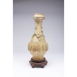 A CHINESE CELADON MOULDED VASE PROBABLY 12TH/13TH CENTURY The pear-shaped body decorated with