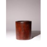 A CHINESE HARDWOOD BRUSHPOT, BITONG QING DYNASTY OR LATER The plain cylindrical body with a recessed