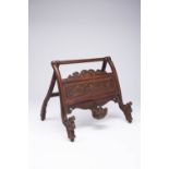 A CHINESE HARDWOOD STAND OR EASEL LATE QING DYNASTY Supported by hinged legs, the front with a panel