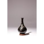 A SMALL JAPANESE SILVER-INLAID BRONZE VASE MEIJI ERA, 19TH CENTURY The pear-shaped body decorated