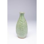 A JAPANESE CELADON MOULDED TOKKURI (SAKE BOTTLE) POSSIBLY EDO PERIOD, 17TH OR 18TH CENTURY The